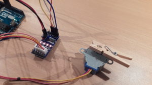 The stepper motor is driven by the ULN2003A driver board. The board's LEDs show the current control sequence state.