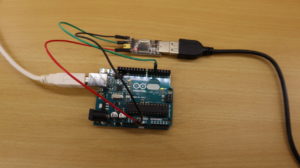 USB-to-TTL serial adapter connected to an Arduino Uno.