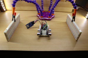 Setup of the tutorial. The ultrasonic sensors measure the distance to the left and right side. The collected data is used to do some statistics.